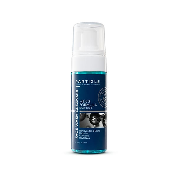 A bottle of Particle Face Wash Cleanser with a blue label