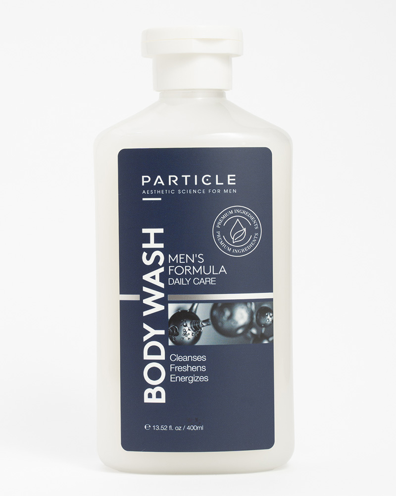 White bottle of Particle, Aesthetic Science for Men, Men's Formula, Daily Care body wash with a navy blue label