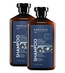 Two brown shampoo bottles with black caps, labeled Particle Men's Formula Daily Care Shampoo.