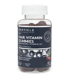 Plastic transparent bottle labeled Particle Hair Vitamin Gummies with dark-colored gummies inside.