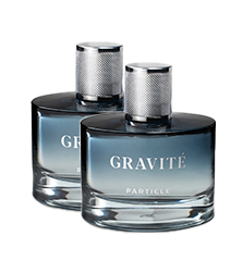 Two identical bottles of Gravité Particlé perfume in a clear blue setting.